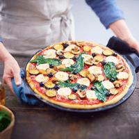 Smooth Pizza Stone On The Barbeque Emile Henry USA Charcoal