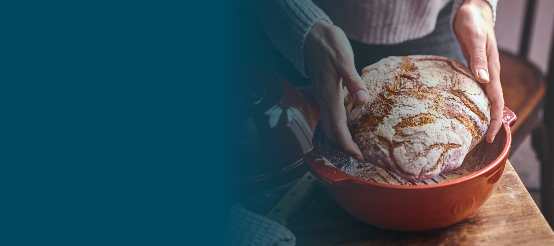 Female hands placing bread into a bread pot